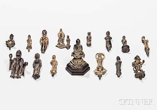 Fifteen Buddhist Gilt-bronze and Bronze Miniature Items 青銅佛造像及法器一組