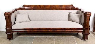 A Flame Mahogany Veneer Classical Sofa, New York, Height 36 x width 88 x depth 29 inches.