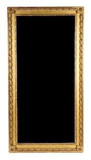 A Neoclassical Style Giltwood Mirror. Height 54 x width 28 inches.