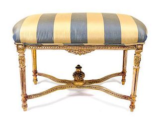 A Louis XVI Style Giltwood Upholstered Bench, Height 28 x width 38 inches.