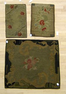 Three hooked rugs with floral decoration, early 20