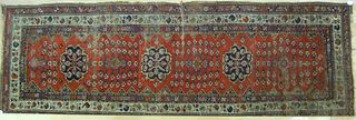 Kazak long rug, early 20th c., 11' x 4'.