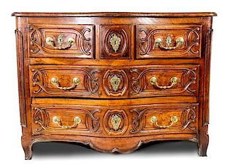 A French Provincial Carved Walnut Chest of Drawers, Height 41 x width 53 x depth 27 inches.