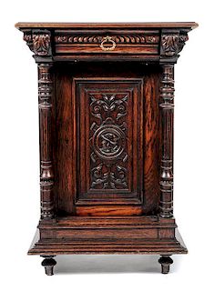 A Renaissance Revival Carved Oak Side Cabinet, Height 40 x width 27 x depth 21 1/2 inches.