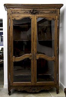 A French Provincial Oak Vitrine, Height 93 x width 56 x depth 17 inches.