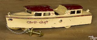 Kilgore cast iron Chris-Craft yacht animated pull toy with a red roof, 11'' l.