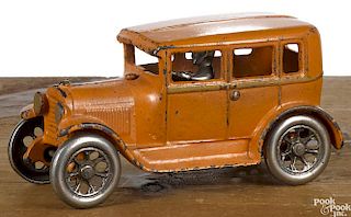 Arcade cast iron four-door sedan with a nickel-plated driver, 6 1/2'' l.