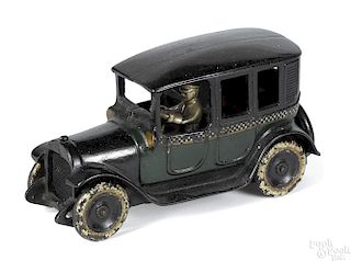Arcade cast iron checker cab with a nickel-plated driver, in hard to find green and black color