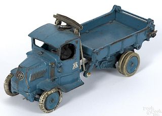 Arcade cast iron Mack T-bar dump truck with a nickel-plated driver and rubber tired disc wheels