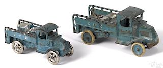 Two Arcade cast iron Mack Ice delivery trucks with nickel-plated drivers, 10 1/2'' l. and 8'' l.
