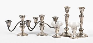 A lot of three pairs of weighted sterling silver candlesticks