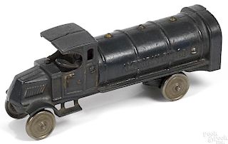 Dent cast iron American Oil Co. tanker truck with a painted driver and nickel-plated disc wheels