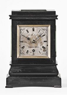 A small English ebonized library clock by Edward Fry Loof