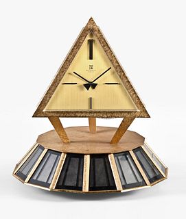 A mid 20th century solar powered pyramid form table clock signed Montre Royale
