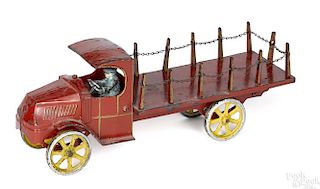 Dent cast iron stake truck with a painted driver, 15 1/2'' l.