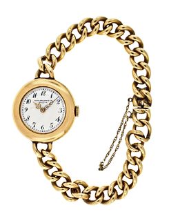 An early 20th century lady's gold Patek Philippe wrist watch with curb link bracelet