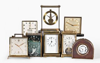 A lot of eight desk and travel clocks