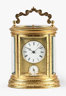 A third quarter 19th century French engraved oval repeating carriage clock