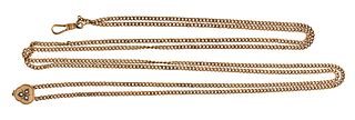 A 10 -12 karat gold curb link watch chain with pearl set slide