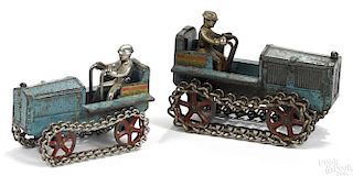 Two Arcade cast iron Caterpillar tractors with nickel-plated drivers, 5 1/2'' l. and 6 1/2'' l.