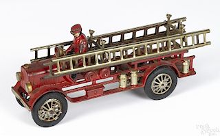 Hubley cast iron fire ladder truck with a painted driver, 13'' l.