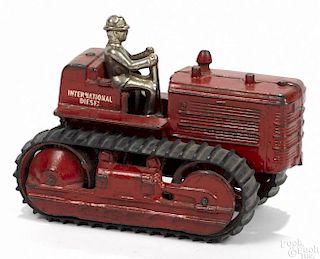 Arcade cast iron International Diesel tractor with a nickel-plated driver, 7 1/2'' l.