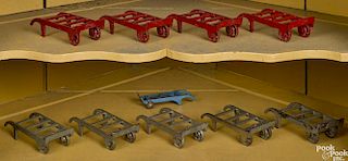 Ten cast iron hand trucks, tallest - 4 3/4''.