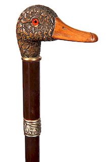 154. Carved Mallard Cane- Early 20th Century- A carved and decorated mallard head with orange and black taxidermy eyes, small