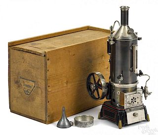 Doll et Cie vertical single cylinder steam engine on a cast iron base with a gear-driven water pump