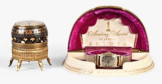 An spherical enameled Zenith desk clock and a Bulova wrist watch
