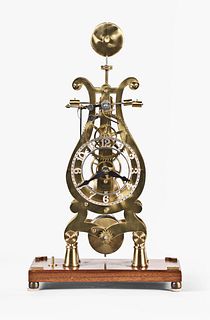 A 20th century lyre plate skeleton clock with grasshopper escapement