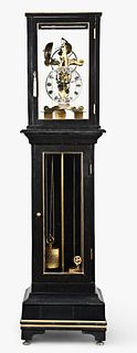 An unusual weight driven skeleton clock with floor standing case signed J. Tritchler London