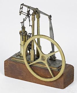 Small brass walking beam engine model, mid 19th c., finely crafted and mounted on a wooden base