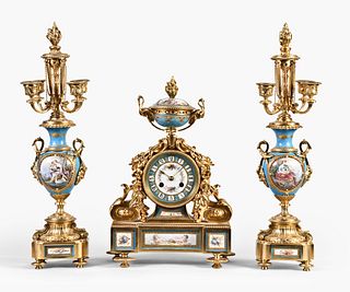 A very attractive late 19th century French three piece clock garniture