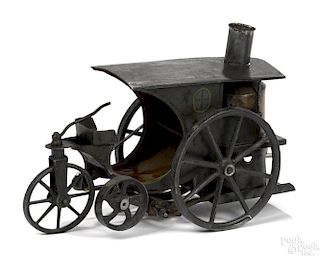 Scarce Schoenner tin live steam trike, hand painted, with cast iron wheels, 6'' h., 8'' w.