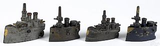 Four cast iron battleship still banks, to include two Grey Iron Maine