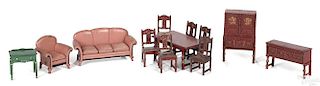 Arcade cast iron twelve-piece living and dining room suites, to include a couch, a chair, a buffet