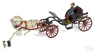 Pratt & Letchworth cast iron horse drawn open Phaeton carriage with a painted driver, 17'' l.