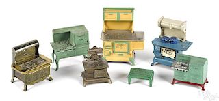 Seven cast iron doll house stoves, to include Arcade, one advertising for The W. J. Loth Stove Co