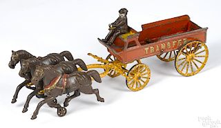 Dent cast iron three-horse drawn Transfer wagon with original driver in a derby hat, 20'' l.