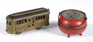 Two cast iron still banks, to include an A. C. Williams Main Street trolley car, 6 5/8'' l.