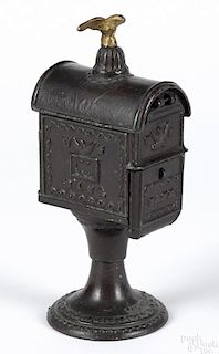 Cast iron U.S. Mail still bank with an eagle finial, 9 1/2'' h.