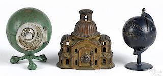 Three cast iron still banks, to include an Arcade dome top, 5'' h., a Grey Iron globe, 5 3/4'' h.