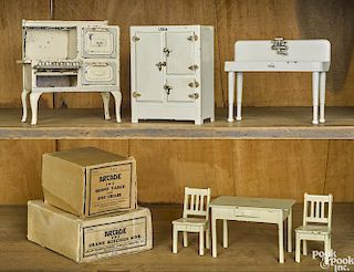 Six-piece Arcade cast iron doll house kitchen, to include a refrigerator, a stove, a sink, etc.