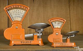 Two Kilgore cast iron Toledo counter scales, 6'' h. and 4'' h.