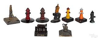Nine cast iron advertising paperweights and novelties, to include four fire hydrants