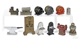 Twelve cast iron advertising machine paperweights, to include a Peerless radiator, 4 1/2'' h.