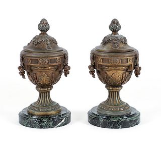 Pair of lidded classical metal urns on marble bases