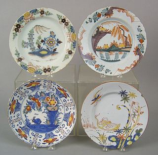 Three Dutch and one English delft polychrome plate