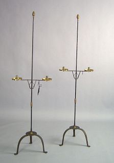 Pair of brass and wrought iron candlestands with a